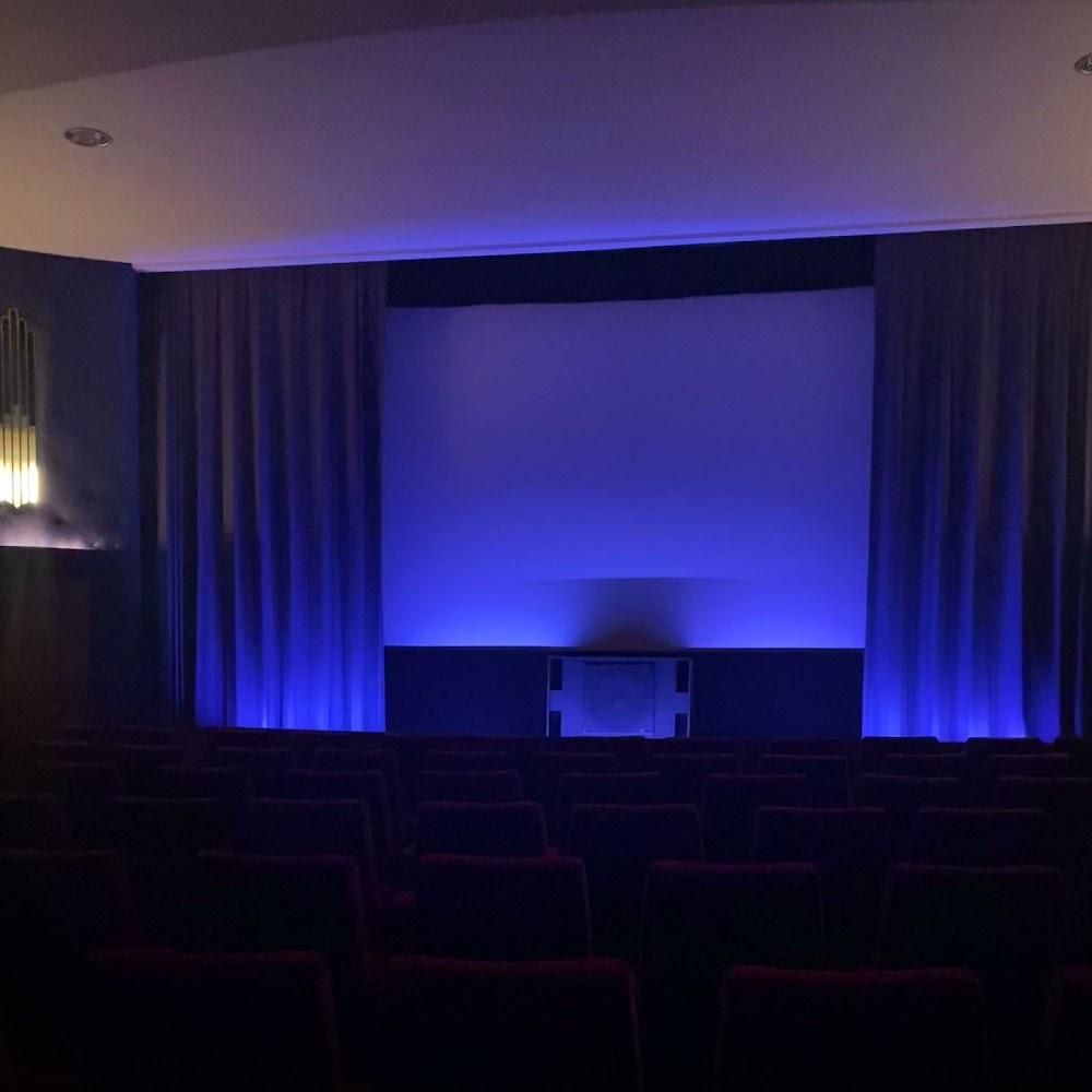 Empty movie theater with blue lights.